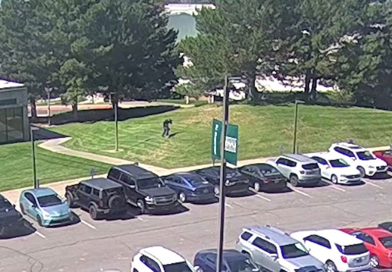 This screenshot taken from a video footage released by the Federal Bureau of Investigation (FBI) on September 11, 2025 shows a person of interest running on the lawn at Utah Valley University in Orem, Utah, immediately after the fatal shooting of Charlie Kirk.