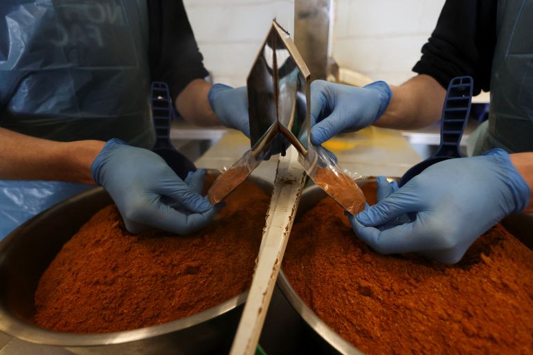 An employee works at at Spice Kitchen, a specialist food manufacturer that exports gift boxes of spices around the world, as the company reacts to U.S President Donald Trump's tariffs, in Liverpool, Britain April 3, 2025. REUTERS/Temilade Adelaja