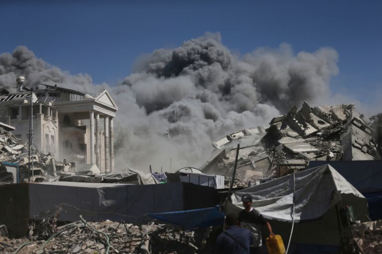 Smoke rises after an Israeli military strike on a building in Gaza City, Saturday, Sept. 13, 2025. (AP Photo/Yousef Al Zanoun)