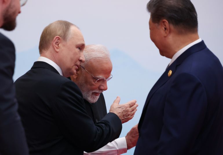 epa12341896 Chinese President Xi Jinping (R), Indian Prime Minister Narendra Modi (C) and Russian President Vladimir Putin (2-L) attend an official welcoming ceremony at the Shanghai Cooperation Organization (SCO) summit in Tianjin, China, 01 September 2025. EPA/ALEXANDER KAZAKOV/SPUTNIK/KREMLIN / POOL MANDATORY CREDIT
