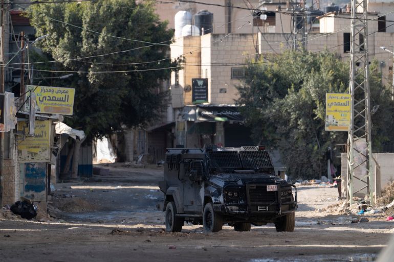 FILE - An armored Palestinian security vehicle is seen as Palestinian forces mount a major raid against militants in the Jenin refugee camp in the Israeli-occupied West Bank, Dec. 23, 2024. (AP Photo/Majdi Mohammed, File)