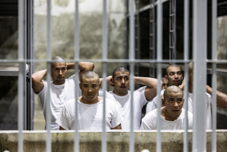 Alleged members of the Venezuelan gang Tren de Aragua and the MS-13 gang, recently deported by the U.S. government, look on from inside a jail at the Terrorism Confinement Center (CECOT) prison, in Tecoluca, El Salvador April 12, 2025. Secretaria de Prensa de la Presidencia/Handout via REUTERS ATTENTION EDITORS-THIS IMAGE HAS BEEN SUPPLIED BY A THIRD PARTY. NO RESALES. NO ARCHIVES