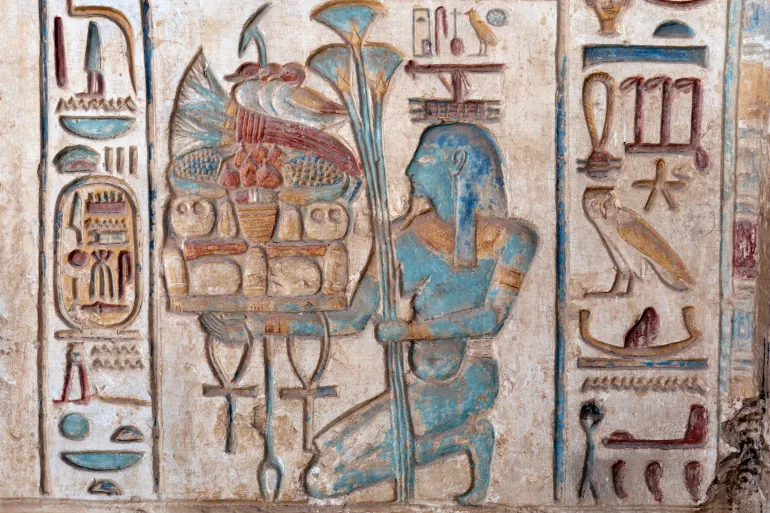 Abydos العرابة المدفونة - أبيدوس colorful wall reliefs represents an offering of food to the Gods in the Temple of Ramesses II at Abydos.
