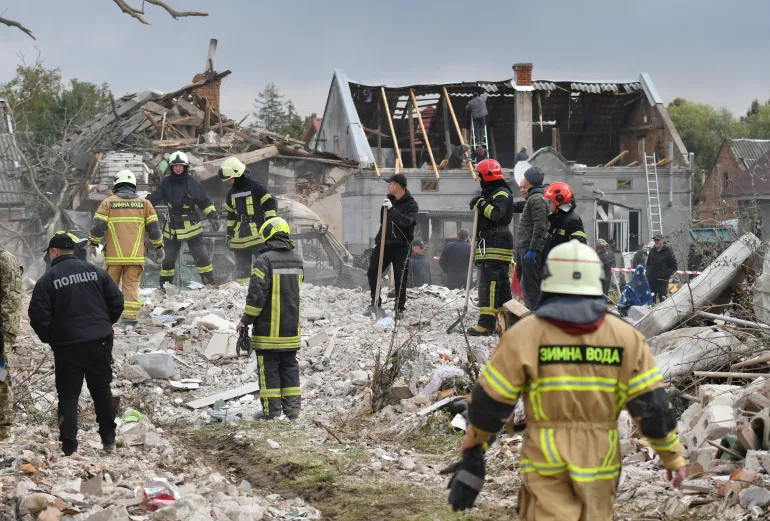 epa12432160 Ukrainian rescuers work at the site of a Russian strike in the Lapoivka village near Lviv, Western Ukraine, on the night of 05 October 2025, amid the ongoing Russian invasion. According to the State Emergency Service report, at least five people died and dozens were injured after Russia launched an overnight attack on Ukraine with more than 50 missiles of different types and 500 shock drones. The Lviv, Ivano-Frankivsk, Zaporizhia, Chernihiv, Sumy, Kharkiv, Kherson, Odesa, and Kirovohrad regions experienced a massive combined attack overnight. EPA/MYKOLA TYS